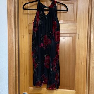 Flowy black dress with red velvet floral accents